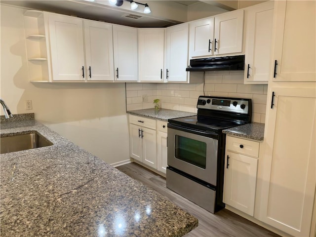 kitchen with open shelves, white cabinets, a sink, under cabinet range hood, and electric stove