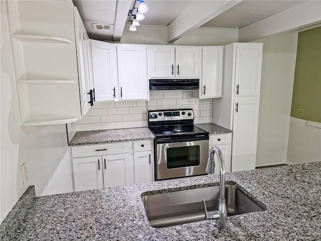 919 N 70th Ter, Kansas City, KS 66112 - kitchen with stainless steel electric range, open shelves, range hood, a sink, and dark stone countertops