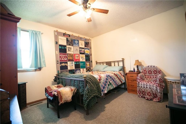 carpeted bedroom with ceiling fan and a textured ceiling