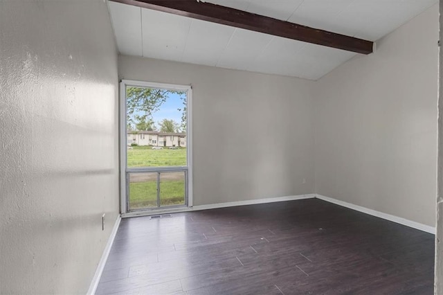 spare room featuring dark wood finished floors, baseboards, vaulted ceiling with beams, and visible vents