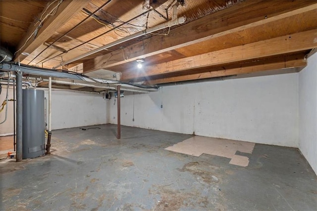 unfinished basement featuring water heater