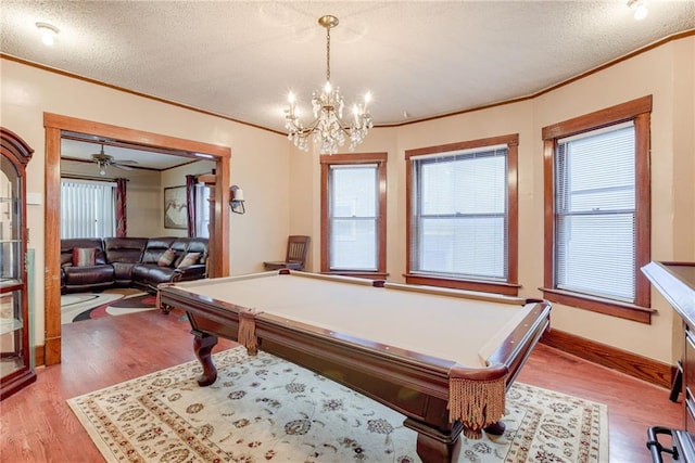 rec room featuring ornamental molding and light wood-style floors