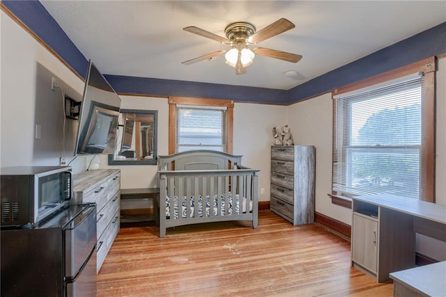 bedroom featuring baseboards and light wood-type flooring