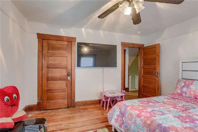 bedroom with wood finished floors and ceiling fan