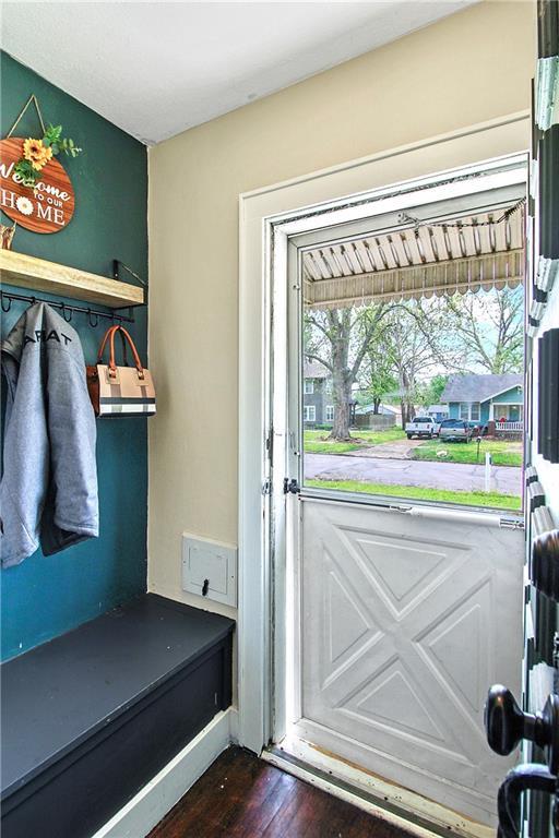 mudroom featuring dark wood-style flooring
