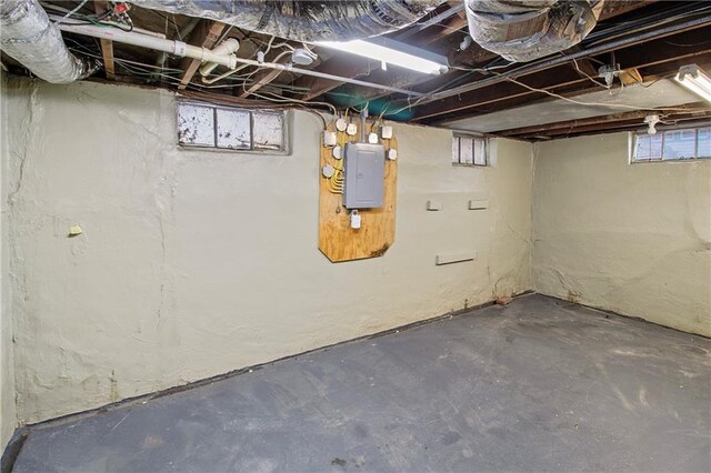 basement featuring electric panel
