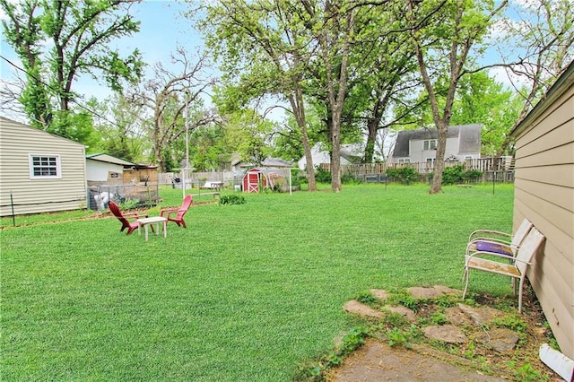 view of yard with an outbuilding and a fenced backyard