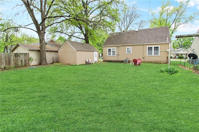 view of yard with cooling unit and fence