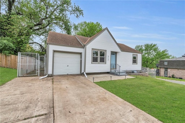 view of front of property featuring a gate, fence, a front lawn, concrete driveway, and an attached garage
