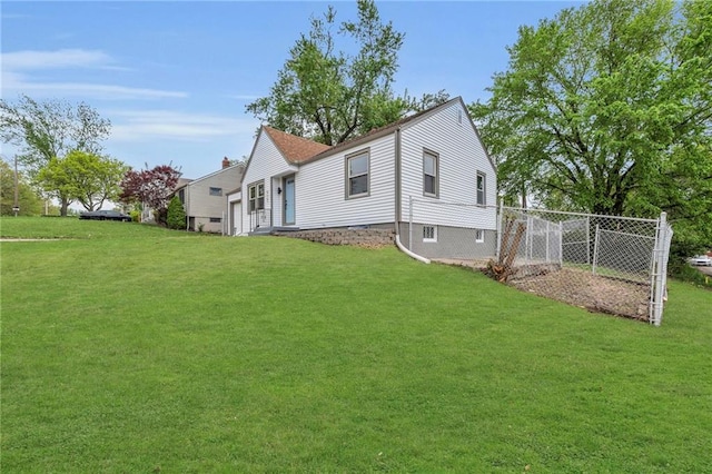 view of property exterior featuring fence and a lawn