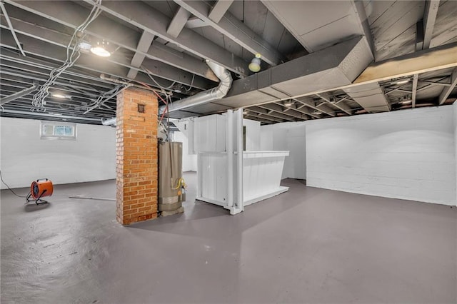 below grade area featuring water heater
