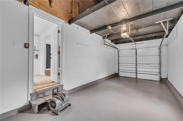 garage featuring baseboards