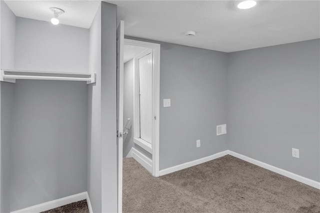 unfurnished bedroom featuring baseboards and carpet