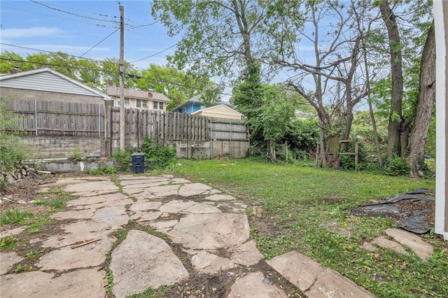view of yard featuring a patio and fence