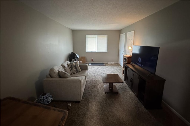 carpeted living room with baseboards and a textured ceiling