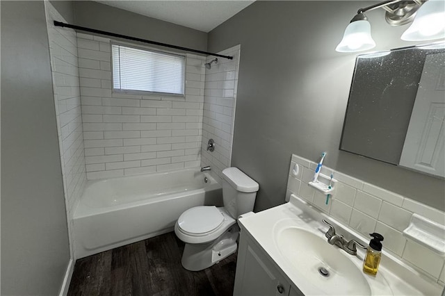 full bathroom with toilet, vanity, shower / washtub combination, and wood finished floors