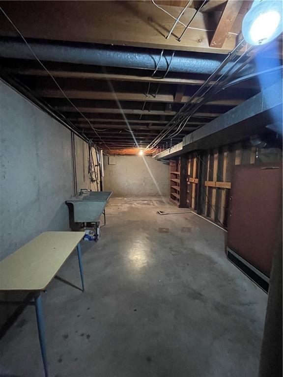 unfinished below grade area with a sink