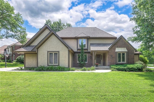 12704 Mohawk Cir, Leawood, KS 66209 - view of front of home featuring stucco siding, a front lawn, and brick siding