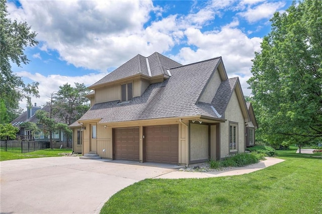 12704 Mohawk Cir, Leawood, KS 66209 - view of side of home with concrete driveway, roof with shingles, stucco siding, and an attached garage