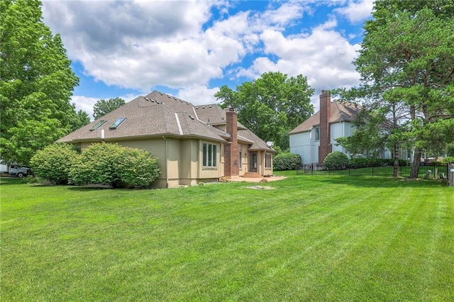12704 Mohawk Cir, Leawood, KS 66209 - back of house featuring stucco siding and roof with shingles