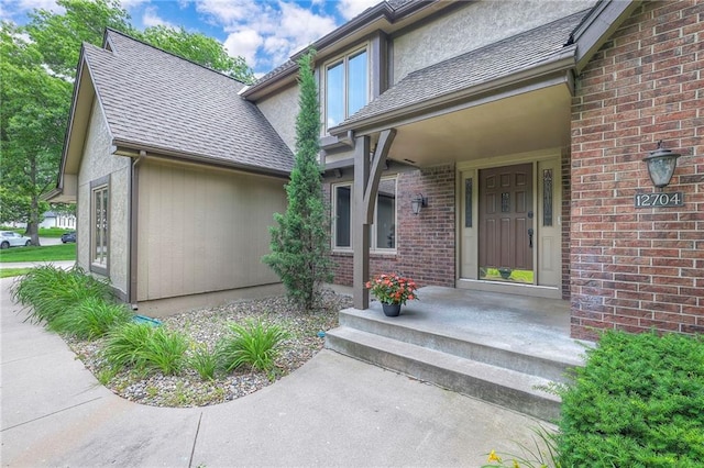 12704 Mohawk Cir, Leawood, KS 66209 - entrance to property featuring brick siding and a shingled roof