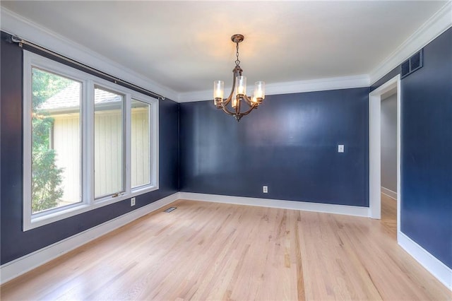 12704 Mohawk Cir, Leawood, KS 66209 - unfurnished room with a chandelier, light wood finished floors, ornamental molding, and baseboards