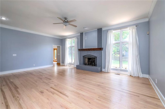 12704 Mohawk Cir, Leawood, KS 66209 - unfurnished living room with a ceiling fan, crown molding, plenty of natural light, baseboards, and light wood-type flooring