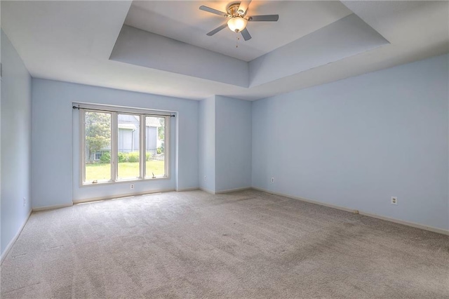 12704 Mohawk Cir, Leawood, KS 66209 - carpeted empty room featuring a raised ceiling, baseboards, and ceiling fan