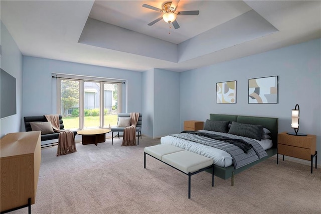 12704 Mohawk Cir, Leawood, KS 66209 - carpeted bedroom with a tray ceiling and ceiling fan