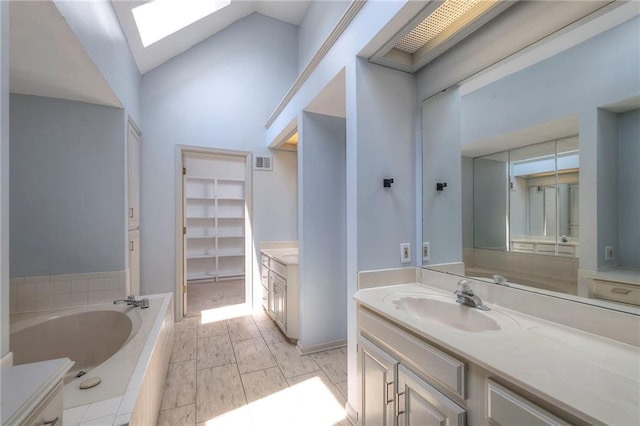 12704 Mohawk Cir, Leawood, KS 66209 - full bathroom with a skylight, vanity, a bath, and lofted ceiling