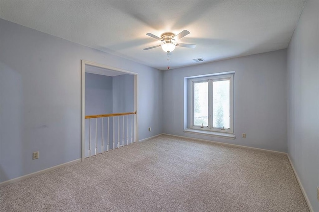 12704 Mohawk Cir, Leawood, KS 66209 - carpeted spare room with ceiling fan and baseboards