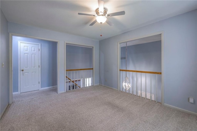 12704 Mohawk Cir, Leawood, KS 66209 - carpeted spare room with ceiling fan and baseboards