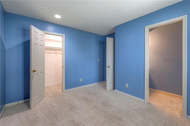 12704 Mohawk Cir, Leawood, KS 66209 - unfurnished bedroom featuring a spacious closet, carpet, a closet, recessed lighting, and baseboards