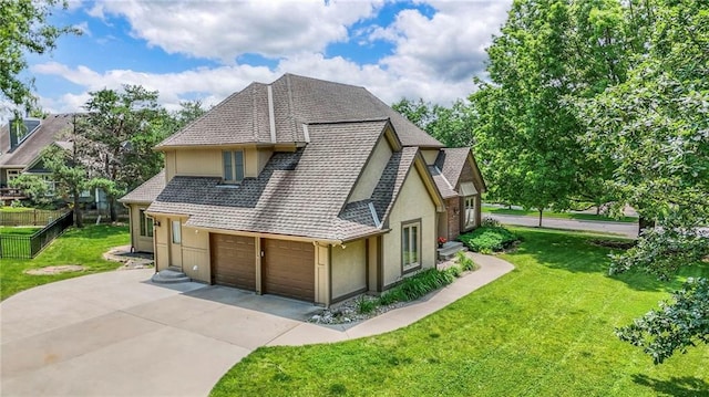 12704 Mohawk Cir, Leawood, KS 66209 - view of side of home with stucco siding, driveway, a shingled roof, and a garage