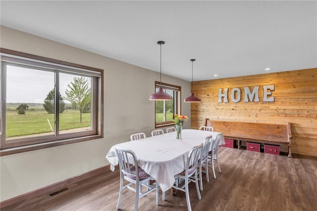 205 N 1700th Rd, Lecompton, KS 66050 - dining room featuring wood walls, wood finished floors, baseboards, and recessed lighting