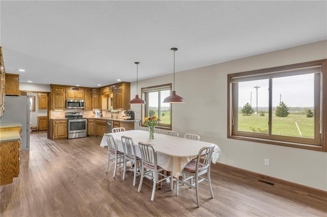 205 N 1700th Rd, Lecompton, KS 66050 - dining room featuring wood finished floors, recessed lighting, and baseboards