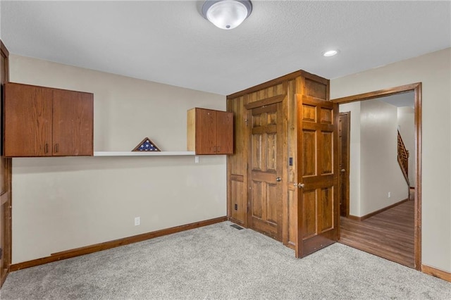 205 N 1700th Rd, Lecompton, KS 66050 - unfurnished bedroom featuring baseboards, carpet, a textured ceiling, and recessed lighting