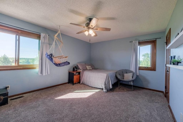 205 N 1700th Rd, Lecompton, KS 66050 - carpeted bedroom with a textured ceiling, baseboards, and a ceiling fan