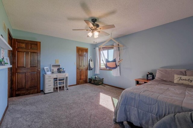 205 N 1700th Rd, Lecompton, KS 66050 - carpeted bedroom with a textured ceiling, baseboards, and ceiling fan