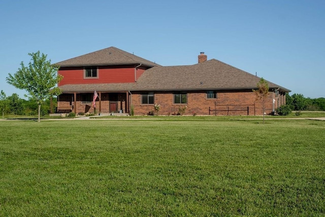 205 N 1700th Rd, Lecompton, KS 66050 - rear view of property with a yard, a chimney, and brick siding