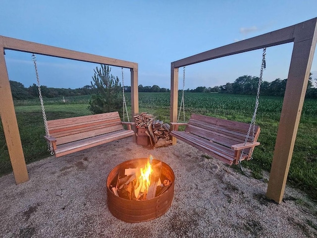 205 N 1700th Rd, Lecompton, KS 66050 - view of yard featuring a fire pit, a rural view, and agricultural area
