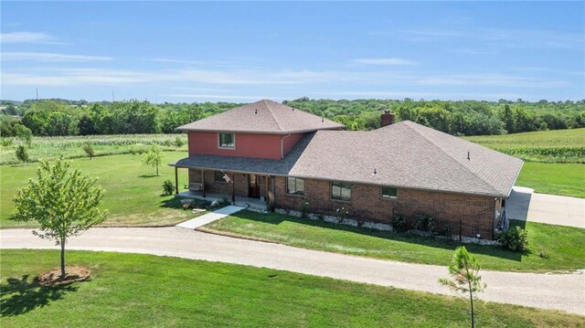 205 N 1700th Rd, Lecompton, KS 66050 - traditional-style home with driveway, a porch, a front yard, and a chimney