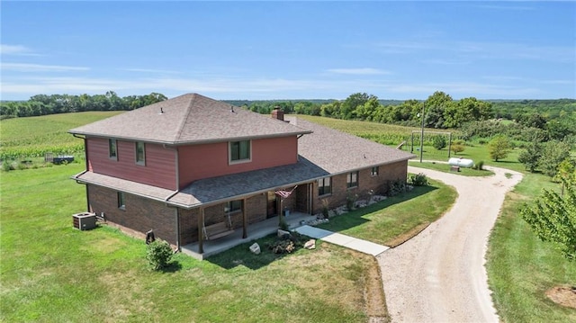 205 N 1700th Rd, Lecompton, KS 66050 - view of front of property with dirt driveway, central air condition unit, a chimney, and a front lawn