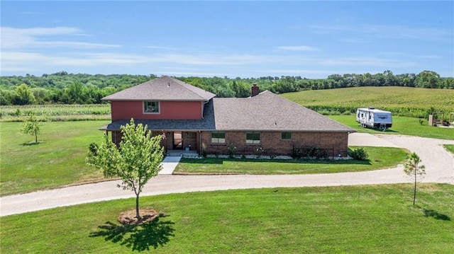205 N 1700th Rd, Lecompton, KS 66050 - view of front of home featuring curved driveway, a front yard, and a rural view