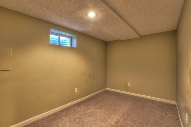 basement with carpet flooring and baseboards