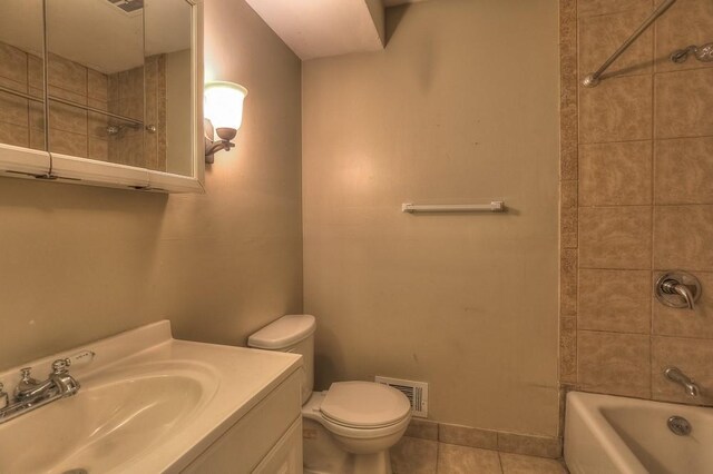 bathroom featuring tile patterned flooring, bathtub / shower combination, toilet, vanity, and visible vents