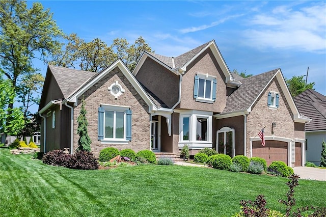 5484 NE Northgate Xing, Lees Summit, MO 64064 - view of front facade with brick siding, concrete driveway, a front yard, and roof with shingles