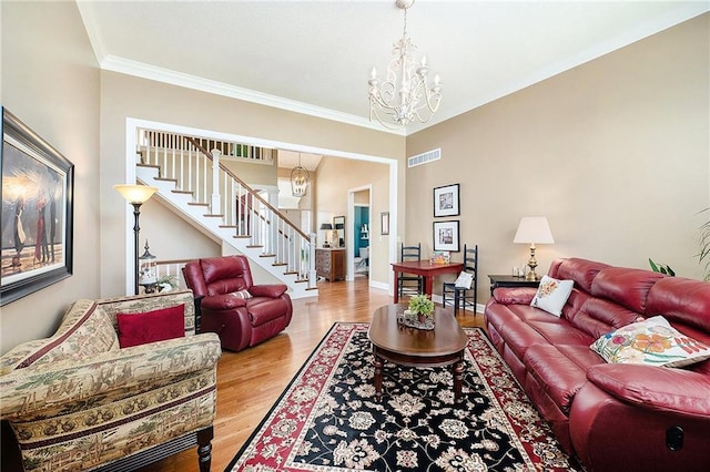 5484 NE Northgate Xing, Lees Summit, MO 64064 - living area featuring a chandelier, stairs, wood finished floors, and crown molding