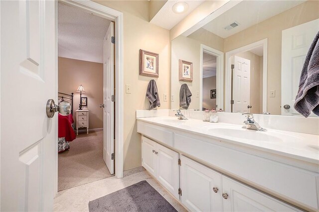 5484 NE Northgate Xing, Lees Summit, MO 64064 - ensuite bathroom with double vanity and tile patterned floors