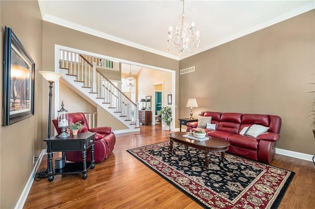5484 NE Northgate Xing, Lees Summit, MO 64064 - living room featuring a chandelier, baseboards, stairway, wood finished floors, and crown molding